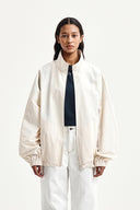 BACK LOGO HIGH NECK JUMPER IN CREAM image 7